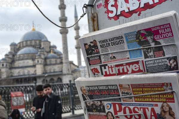 Istanbul, Turkey. January 8th 2025. Turkish daily newspapers displayed on a stand near the Yeni Camii or New Mosque in the Eminonu district of Istanbul, Turkey