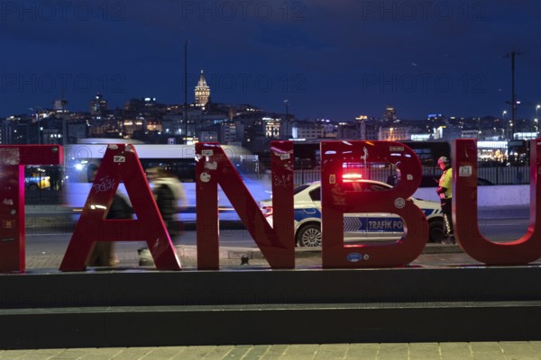 Istanbul, Turkey. January 3rd 2025. A busy road at night with a police traffic patrol in the Eminonu district of Istanbul on the European side of the Turkish city