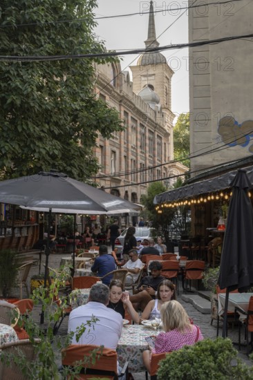 Tbilisi, Georgia. July 29th 2025. Locals and tourists enjoying the café culture of the Old Town in Tbilisi, Georgia