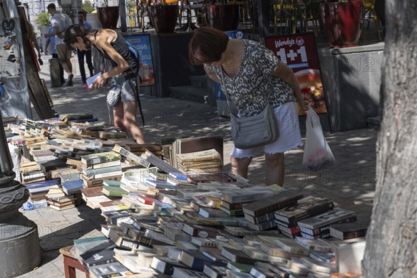 Tbilisi, Georgia. August 13th 2025. Shopping for secondhand books on the street near Freedom or Liberty Square, Tbilisi, Georgia