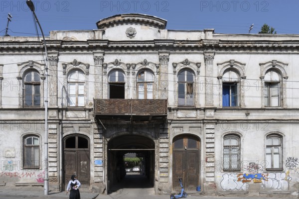 Tbilisi, Georgia. August 5th 2025. An old traditional style Georgian building façade leading to a so called Italian Courtyard, Tbilisi, Georgia
