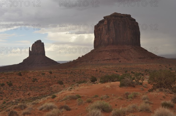 Large and small rock formations in the desert landscape of Monument Valley, Navajo Tribal Park, Navajo Nation Reservation, Utah, Arizona, USA