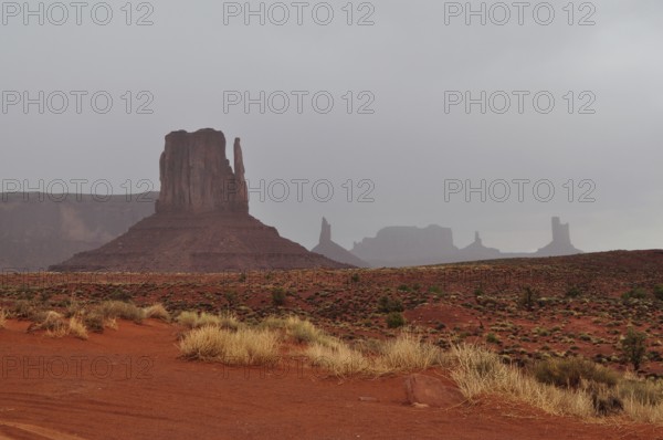View of Monument Valley's distinctive rock formations after a heavy thunderstorm. Monument Valley, Navajo Tribal Park, Navajo Nation Reservation, Utah, Arizona, United States of America