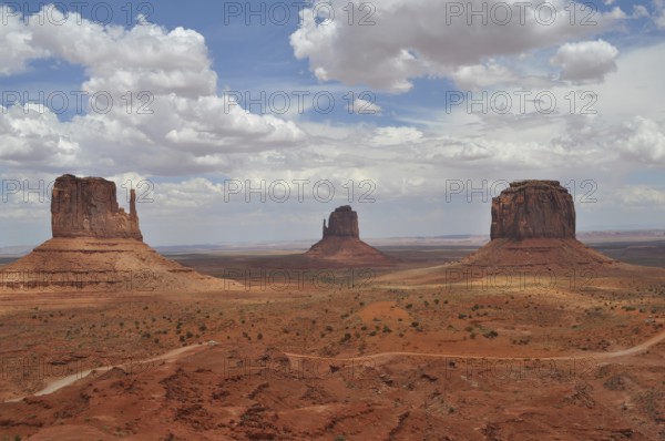 Dramatic rock formations against a cloudy sky in Monument Valley, Navajo Tribal Park, Navajo Nation Reservation, Utah, Arizona, USA