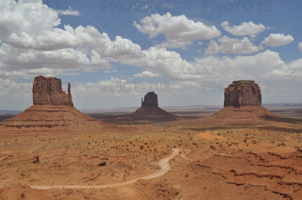 Three distinctive rocks in Monument Valley against a dramatic cloudy sky, Monument Valley, Navajo Tribal Park, Navajo Nation Reservation, Utah, Arizona, USA