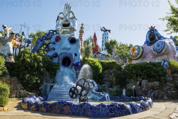 Colourful sculptures made of glass and mirrors, Giardino dei Tarocchi, Garden of Tarot, by Niki de Saint Phalle, near Capalbio, Province of Grosseto, Tuscany, Italy