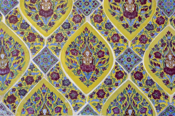 Coloured Bencharong ceramic tiles, depiction of Thai angels (devas) in diamond-shaped frames, circular gallery (Phra Rabieng) around the central chedi, Wat Ratchabophit (full name Wat Ratchabophit Sathit-Mahasimaram Ratcha Wora Maha Viharn), Buddhist temple, Wat, Phra Nakhon district, Bangkok, Thailand