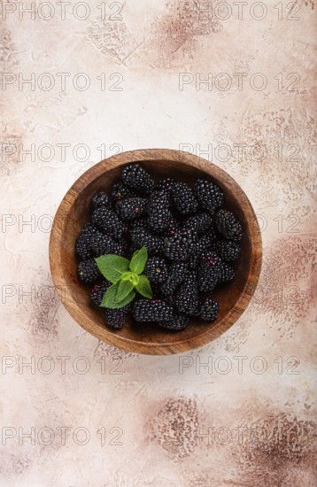Blackberries, in a wooden bowl, top view, no people