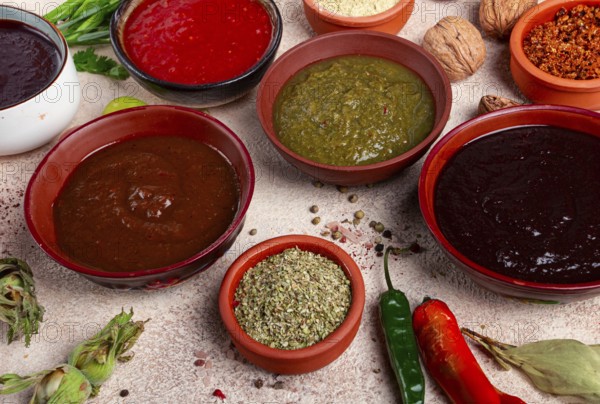 Assortment of Georgian sauces and spices, top view, set of spices and tkemali, Georgian, food background
