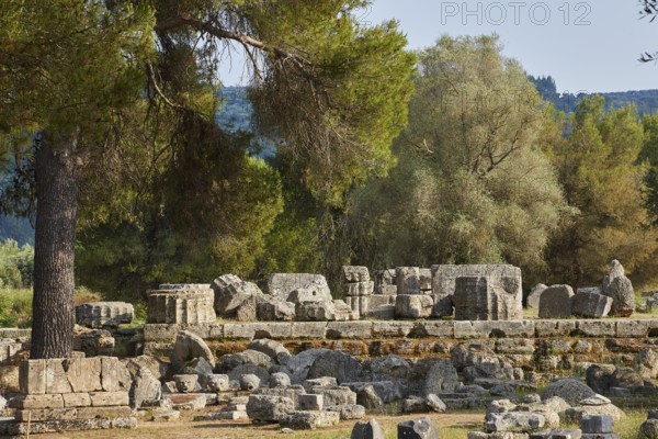 Hera Temple, Heraion, Ancient stone structures surrounded by trees in an idyllic landscape, Archaeological Site, Ancient Olympia, Olympia, Peloponnese, Greece