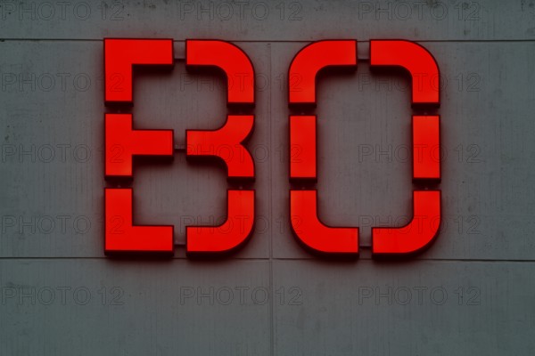 Detailed view of the red BO logo in the evening at the main building of Bochum University, Ruhr region, North Rhine-Westphalia, Germany