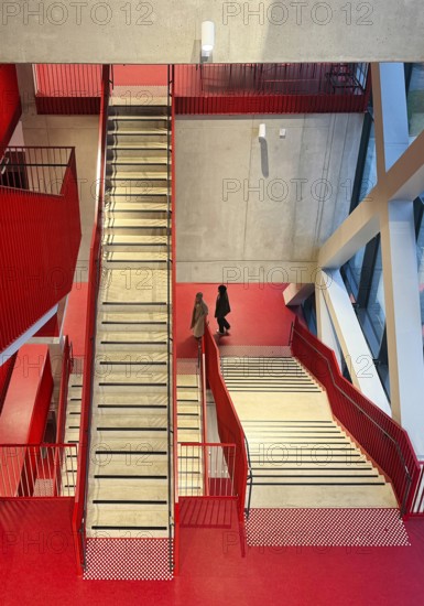 Staircase with signal red color scheme in seminar building H of Bochum University, Ruhr area, North Rhine-Westphalia, Germany