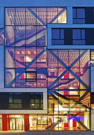 Bochum University seminar building in the evening with an eye-catching staircase with a signal red color scheme, Ruhr area, North Rhine-Westphalia, Germany