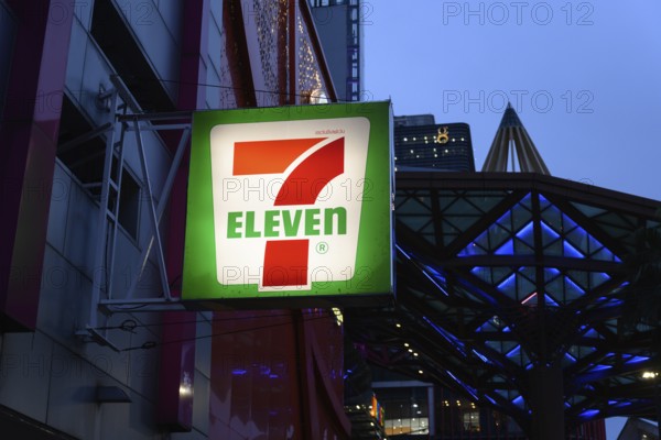 7 Eleven shop front sign and logo outside the popular convenience shop and supermarket in central Bangkok, Thailand