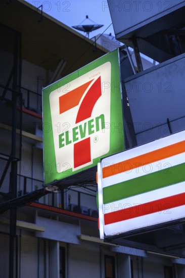 7 Eleven shop front sign and logo outside the popular convenience shop and supermarket in central Bangkok, Thailand