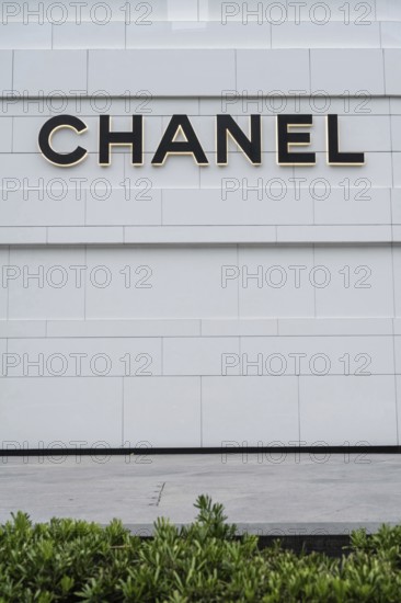 Chanel fashion store logo displayed in a fashionable shopping district of Bangkok, Thailand
