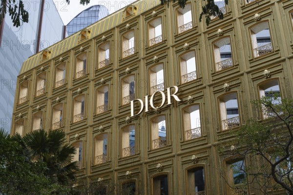 Dior designer fashion logo displayed on the flagship store in a fashionable shopping district of Bangkok, Thailand