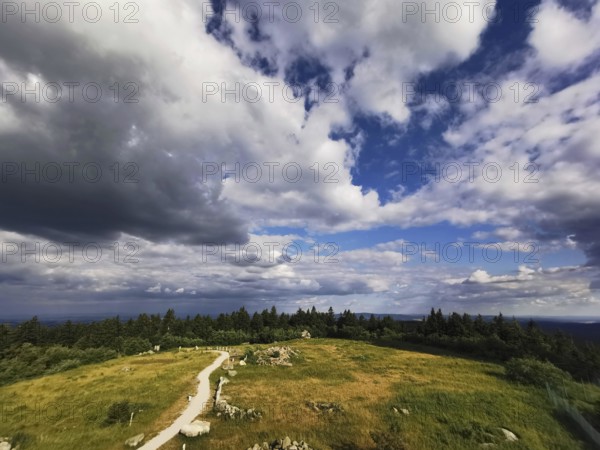 A wide view of the Schneeberg with a hiking trail under a big, blue sky, Franconian mountain trail, hiking in the Fichtelgebirge nature park Park