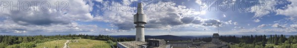Panoramic view of the Schneeberg with the Backöfele, a high tower under a sunny sky full of clouds, Franconian mountain trail, hiking in the Fichtelgebirge nature park Park