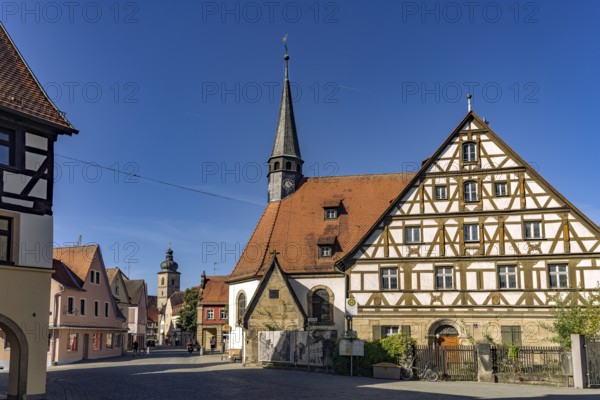 Half-timbered house and the Roman Catholic hospital church of St. Katharina in Forchheim, Upper Franconia, Bavaria, Germany
