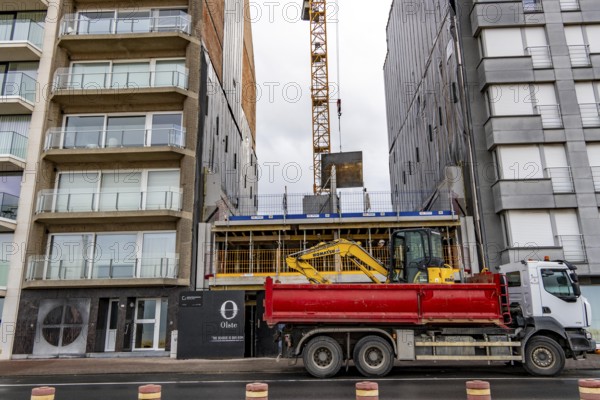 The skyline of Knokke-Heist, on the North Sea beach, dreary winter day, mostly apartment buildings with rental or condominiums, high-rise buildings on the Zeedijk-Knokke street, vacant lot, new residential building, Belgium