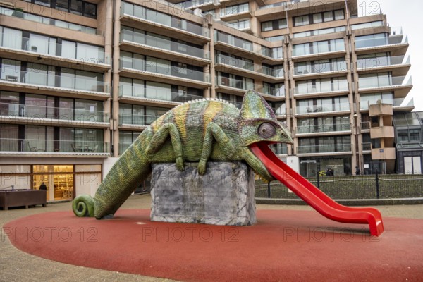 Art in Knokke-Heist, chameleon, tongue as a slide, by Jeremy Deller, part of the Beaufort Triennial, many permanent works of art in public spaces are spread around the city, dreary winter day, Belgium