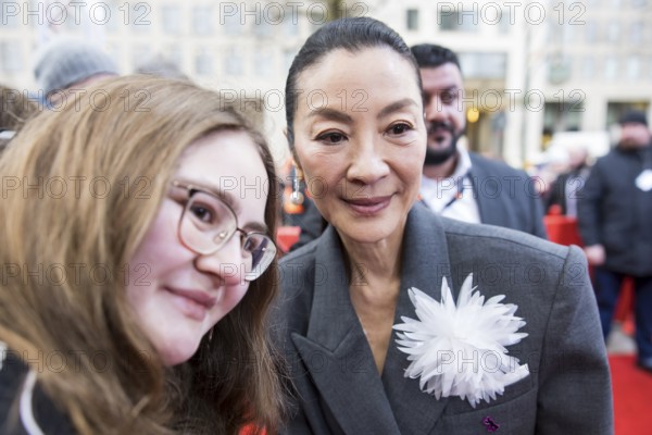 Michelle Yeoh has herself photographed with fans in front of the premiere of the film Everything Everywhere All At Once at the Berlinale in Berlin's Zoo Palast on 13.02.2026. The 76th Berlin International Film Festival will take place from February 12 to 22, 2026