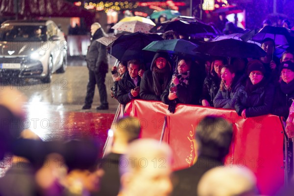 Fans in the rain with umbrellas at the opening of the Berlinale at the Theater am Potsdamer Platz in Berlin on 12.02.2026. The 76th Berlin International Film Festival will take place from February 12 to 22, 2026