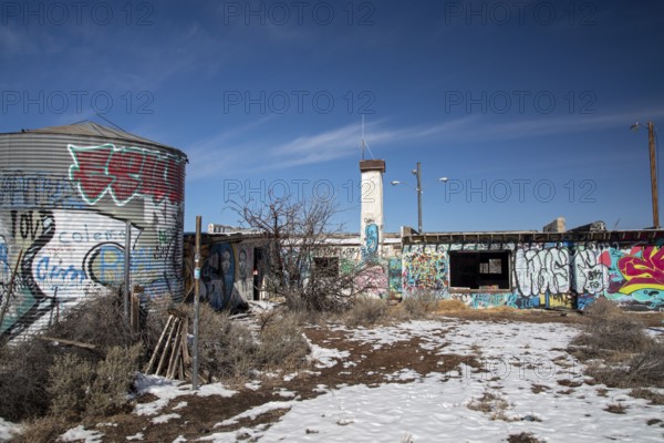 Twin Arrows, Arizona - The ruins of the Twin Arrows Trading Post, which closed in 1995. The building are now covered with graffiti, and one of the two arrows has fallen