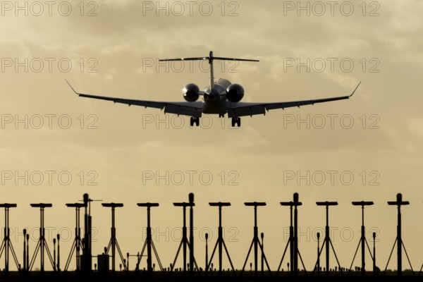 Gulfstream executive business jet aircraft in flight on approach to land at sunset at London Stansted airport, Essex, England, United Kingdom