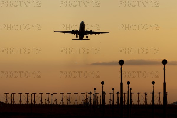 Boeing 737 commercial passenger airliner jet aircraft of Ryanair airlines in flight taking off at sunset at London Stansted airport, Essex, England, United Kingdom