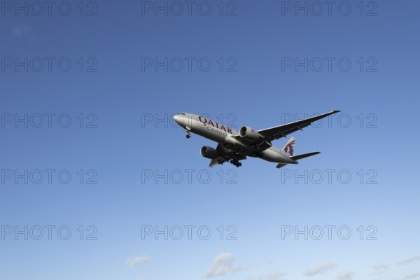 Boeing 777 A7-BFL commercial jet aircraft of Qatar cargo in flight on approach to land at London Stansted airport, Essex, England, United Kingdom