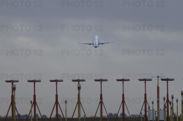Boeing 737 commercial passenger airliner jet aircraft taking off in flight at London Stansted airport, Essex, England, United Kingdom