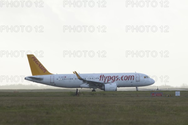 Airbus A320 TC-NCK commercial passenger airliner jet aircraft of Pegasus airways waiting to take off at London Stansted airport, Essex, England, United Kingdom