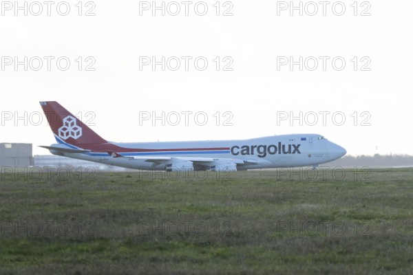 Boeing 747-400 jumbo jet LX-TCV commercial aircraft of Cargolux cargo waiting to take off at London Stansted airport, Essex, England, United Kingdom