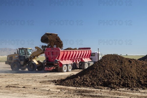 Buckeye, Arizona - Fresh soil is spread on a farm in the Arizona desert