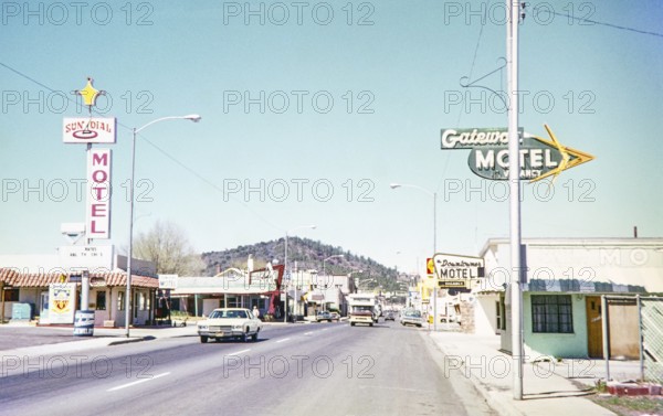 Motels line roadside on Route 66 road in centre of Williams, Arizona, USA 1976