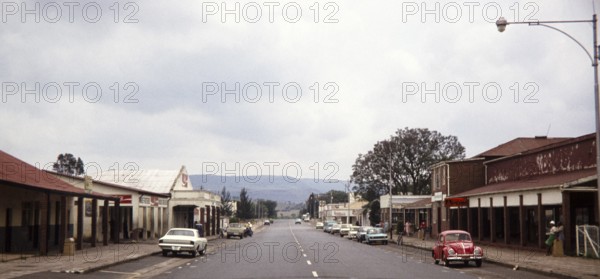 Typical road running through Main Street of country town with shops lining the roadside, South Africa, Africa 1979