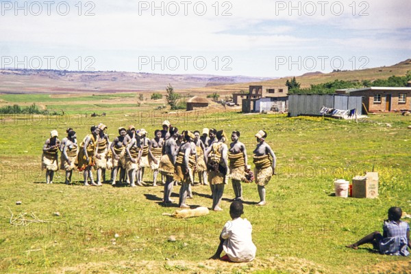 Basotho women dancers in traditional attire practice a performance in a rural area, South Africa, Africa 1979