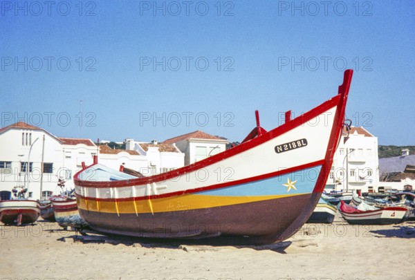 Traditional fishing boat on beach, Nazaré, Portugal, Europe 1968 - this vessel is now on display at the Maritime Museum, Lisbon