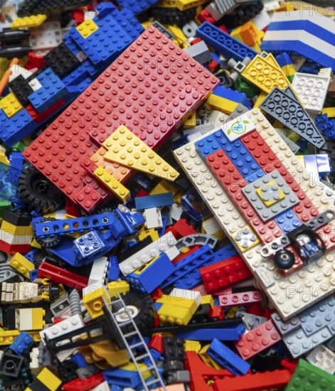 Assortment of unsorted Lego building bricks and construction items, children's toys, UK