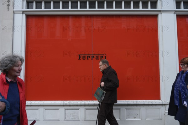 London, UK. January 29th 2025. Red hoarding surrounding the new Ferrari boutique selling replica fashion clothing and accessories, store on the corner of Old Bond Street and Piccadilly in the West End of London, UK