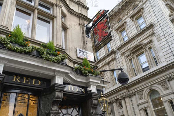 London, UK. January 31st 2025. The Red Lion Pub and restaurant with an elaborate ceiling, politicians' portraits and famous former clientele, very close to the British Parliament and Downing Street in Westminster, London