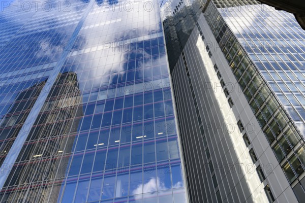 Modern abstract reflections in glass fronted commercial office buildings in the financial district of the British capital London