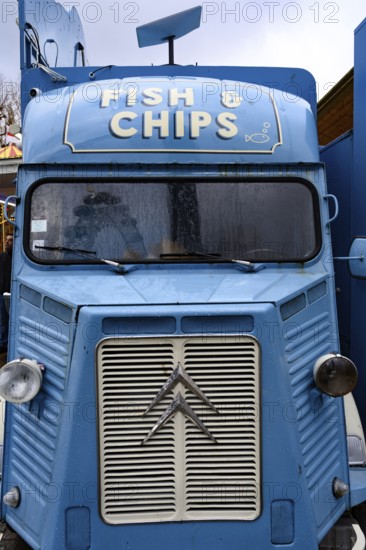 A blue retro Citroen food truck selling traditional British fish and chips on the south bank of the Thames, London, UK