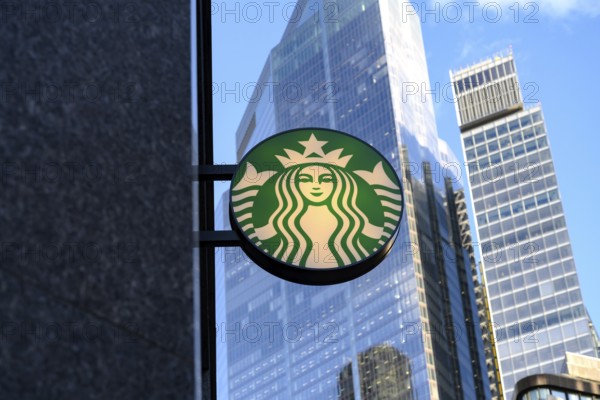 London, UK. January 29th 2025. Brand logo sign for American Starbucks Corporation, the Seattle based multinational, outside a café in the financial district of The City of London, UK