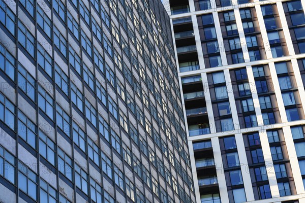 Abstract modern glass fronted designed offices and apartment buildings, high rise property in central city of London, capital of the UK