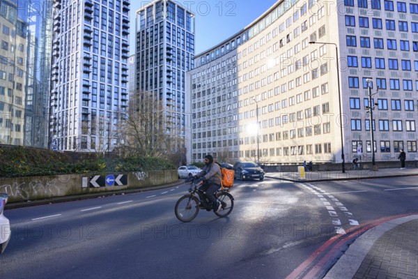 London, UK. January 31st 2025. A typical cycle food delivery guy riding his bike through the streets near Waterloo Station on the South Bank of London, UK