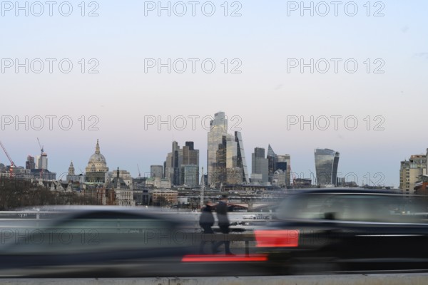 London, UK. January 30th 2025 View of the high rise banks and offices of the City of London financial district as traffic speeds past during the rush hour, London, UK