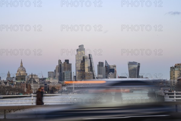 London, UK. January 29th 2025. View of the high rise banks and offices of the City of London financial district as a taxi speeds past during the rush hour, London, UK